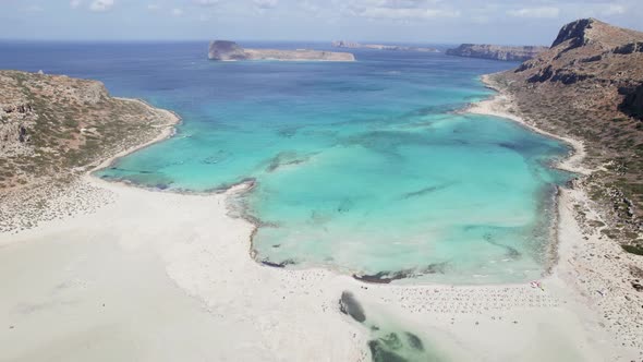 Aerial drone shot of beautiful white sand Balos beach with turquoise water. Sunny summer day.