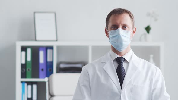 Professional medical doctor working in hospital office using computer technology.