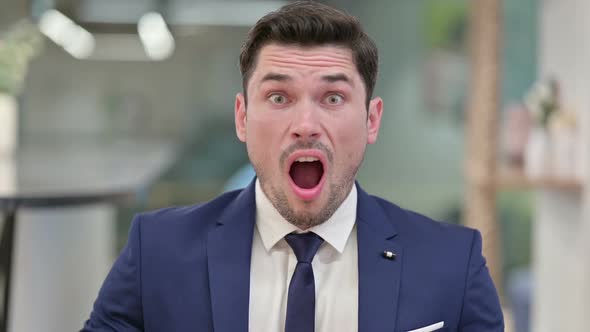 Disappointed Young Businessman Reacting to Loss Failure