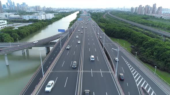 Aerial Drone View of Highway Multilevel Junction Road with Moving Cars at Sunset