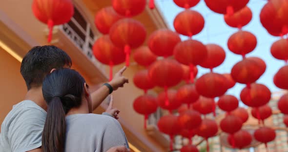 Couple Look at The Red Lantern in The Street