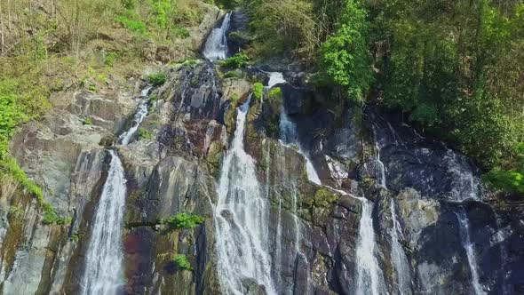 Camera Moves Down Along Wonderful Great Waterfall on Cliff Rocks