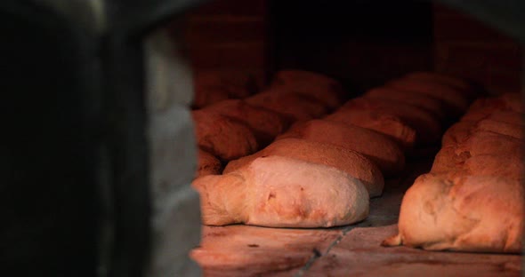 Cooking And Baking Breads Inside The Hot Oven. - close up shot