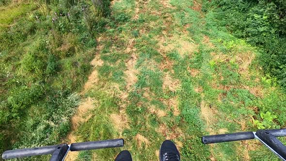 Girl Rides or Climbs on Lift or Cable Car Up Mountain