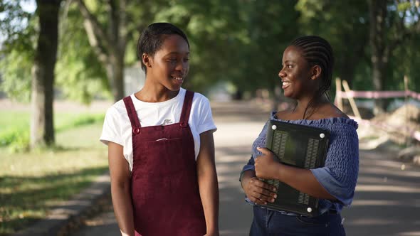 Positive African American Groupmates Standing in Summer Park in Sunshine Laughing