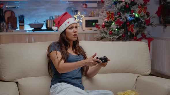 Sad Person Playing Video Games with Controller on Console
