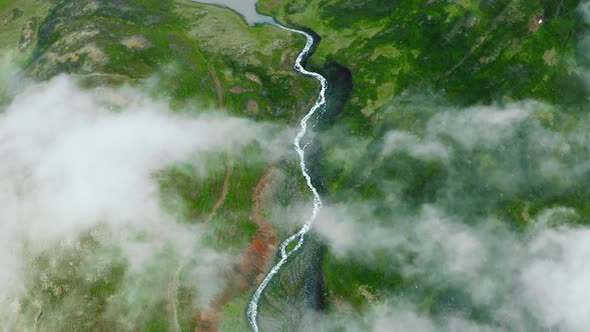 Aerial Top View of Nordic Landscape Flyover Green Valley Beautiful Formations Flight Through Rainy