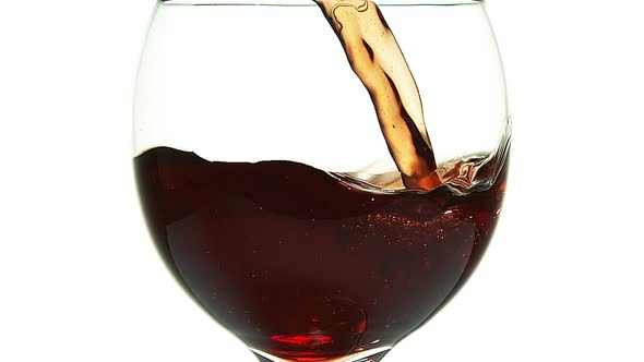 980016 Red Wine being poured into Glass, against White Background, Slow motion