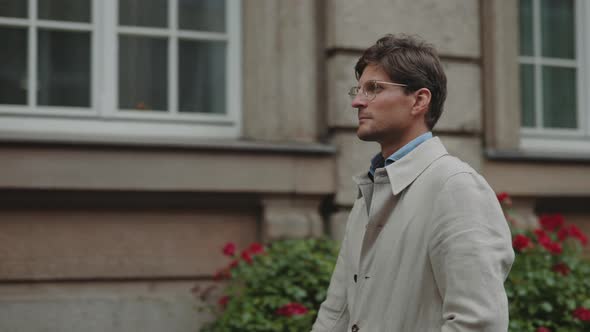 Confident Male Person in Formal Clothes Walking Outdoors