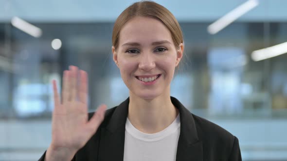 Portrait of Beautiful Woman Waving Welcoming