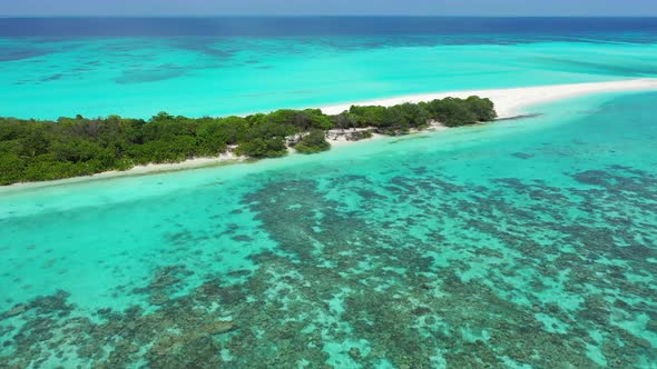 Luxury drone copy space shot of a sunshine white sandy paradise beach and blue water background in b