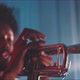 A professional trumpeter plays with smoke and neon lights in his room - VideoHive Item for Sale