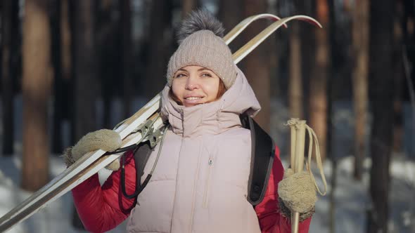 Happy Woman Getting Ready To Ski Looks Around