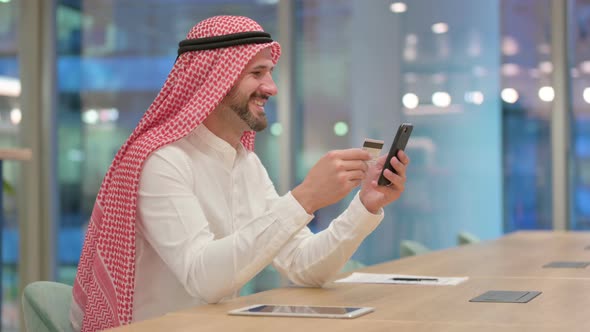 Arab Businessman Making Online Payment on Smartphone