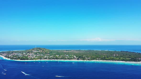 Aerial top view scenery of marine bay beach wildlife by blue water and white sand background of a da