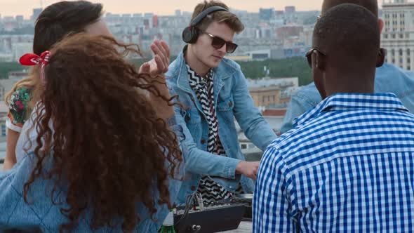 Dj Mixing Electronic Music at Rooftop Party