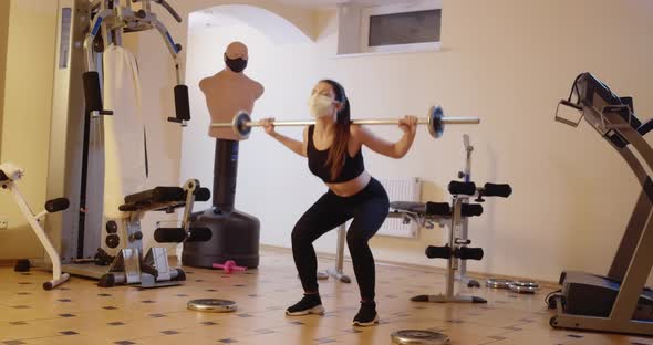 Wide Shot of Slim Sportswoman Training in Gym on Coronavirus Pandemic