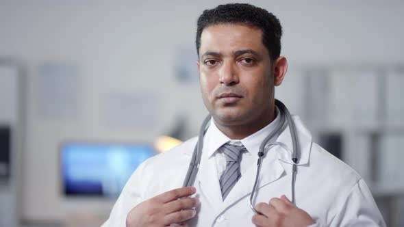Physician Putting On Stethoscope
