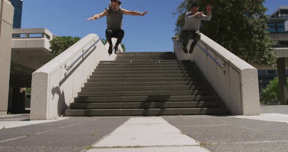 Caucasian men practicing parkour