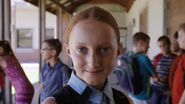 Girl smiling in the school corridor