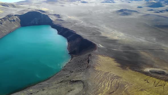 Volcanic lake behind hill slope