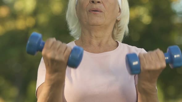 Old Woman Lifting Dumbbells