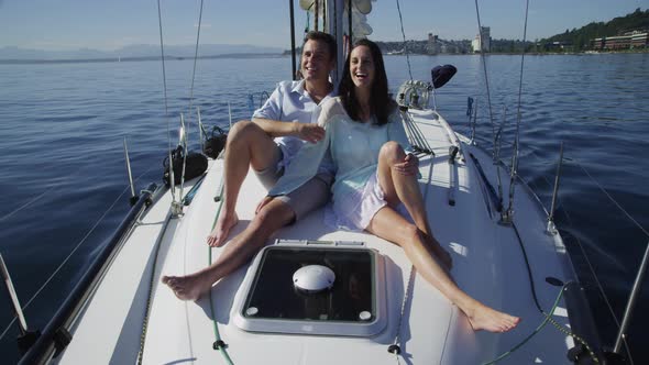 Young couple on sailboat together. Shot on RED EPIC for high quality 4K, UHD, Ultra HD resolution.