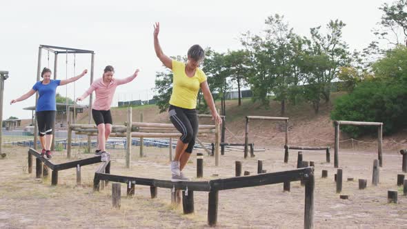 Female friends enjoying exercising at boot camp together