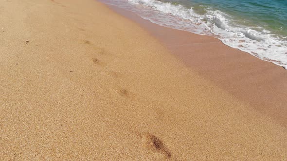 Aerial View of Traffic Over the Golden Seashell Beach and Azure Sea