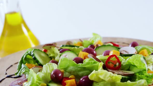 Sauce being poured in salad