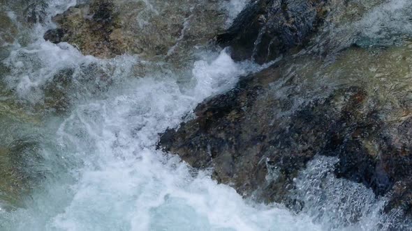 River Rushing Over Colorful Rocks