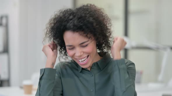 African Woman Celebrating Success