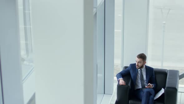 Successful Businessman in Chair