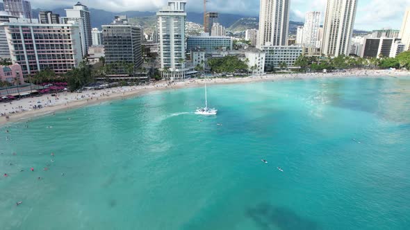 Aerial view of a luxury dinner cruise boat departs with couples looking to enjoy a sunset dinner.