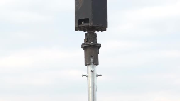 Footage of a Machine Grabbing a Steel Pole and Moving It