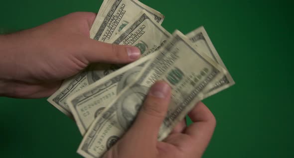 Dollars. American Money Close-up on a Green Background Hromakey . 100 Dollar Bills. One Hundred