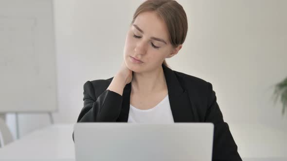 Close Up of Young Businesswoman Relaxing Neck Pain