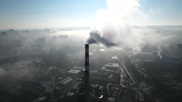 Aerial drone view of Chisinau. Thermal station with smoke coming out of the tube