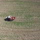 Aerial view, Farmer Drives Old Tractor Sow Buckwheat Seeds - VideoHive Item for Sale