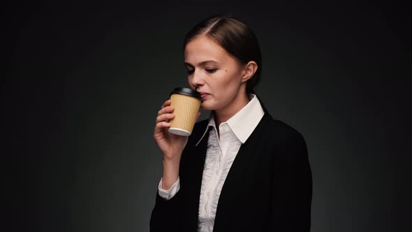 Attractive Brunette Business Woman with Coffee Togo