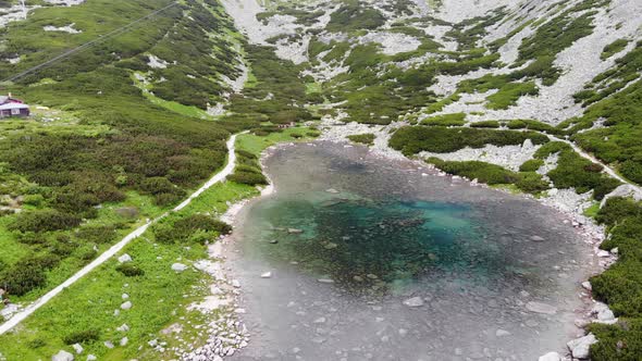 AERIAL: Blue Lake on the Mountain in Slovakia