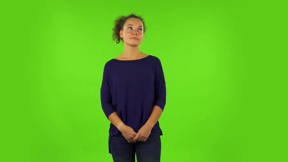 Curly Woman Listening Carefully To Boring Information. Green Screen