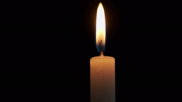 Close Up View of Burning a Candles on on a Dark Background