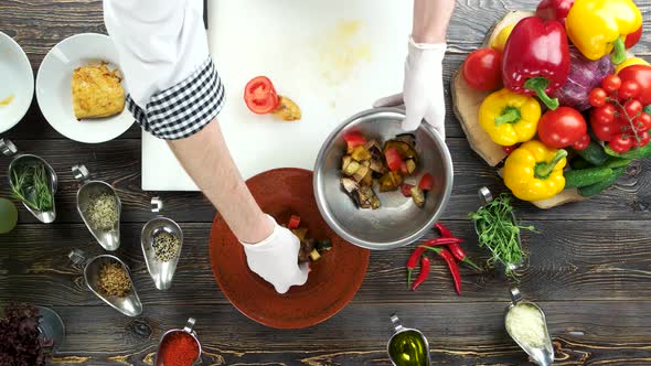 Hands Making Salad, Wooden Table.