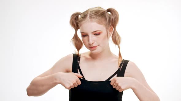 Young Beautiful Girl Correcting Blouse Over White Background