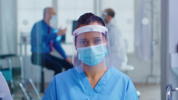 Medical Assistant with Visor and Face Mask
