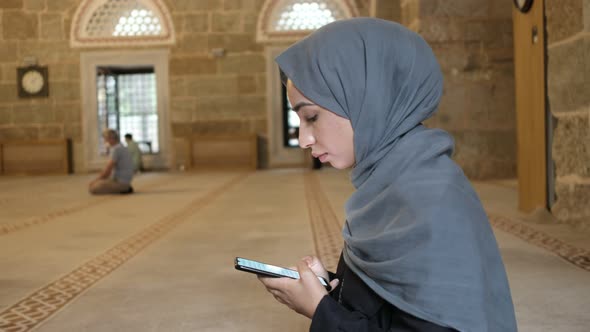 Praying at Mosque Young Muslim Woman Reading Islamic Holybook Smarthphone