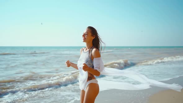 Slow Motion of Happy Joyful Slim Fitbody Woman Wearing in Bikini and Enjoying Wind and Waves on Sea