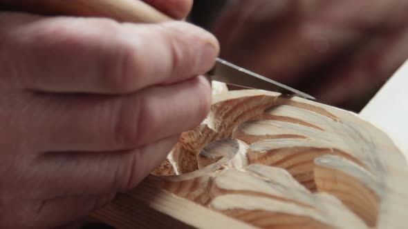 Closeup shoot of a woodcarver at work