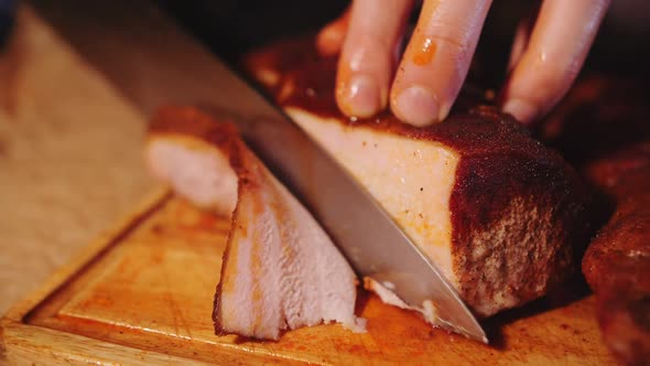 footage of slicing smoked pork